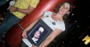 woman holding picture of michael jackson