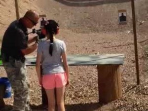 girls shoots instructor with uzi